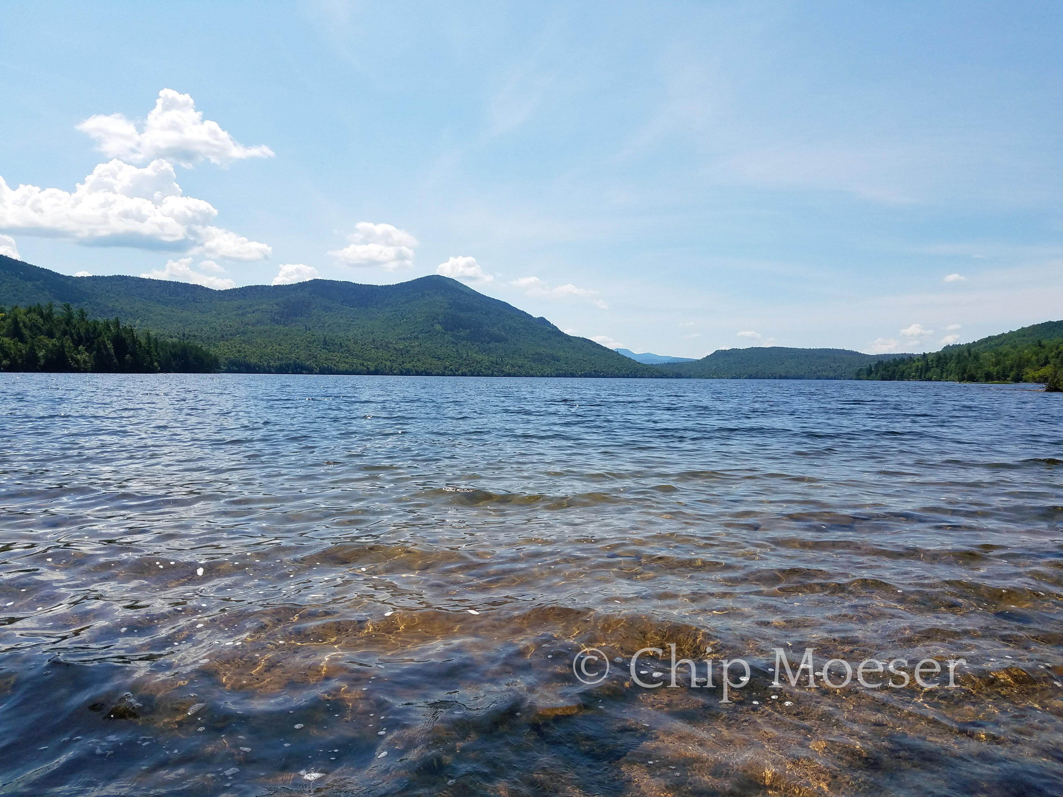 North east shore of Taylor Pond with Catamount Mountain and the High Peaks visible in the distance.